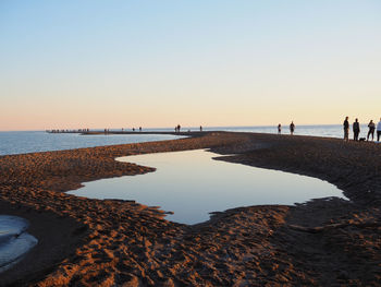 Scenic view of sea against clear sky during sunset