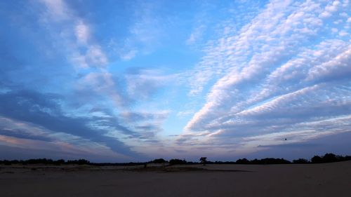 Scenic view of silhouette landscape against sky during sunset