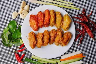 High angle view of fruits in plate on table