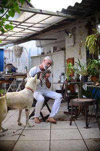 Man sitting on chair at table