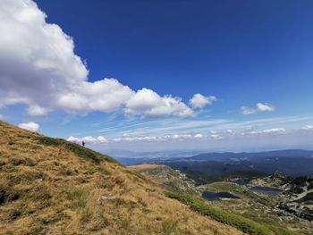 Scenic view of landscape against blue sky