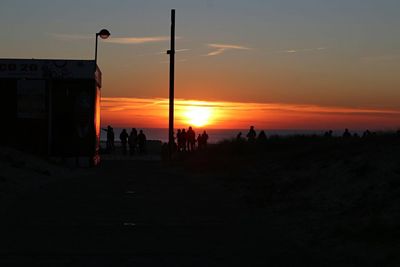 Silhouette people at sunset