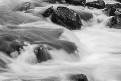 Blurred motion of water flowing through rocks