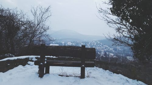 Built structure on snow covered landscape against sky