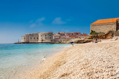 The beautiful banje beach and dubrovnik city