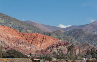 View of landscape with mountain range in background