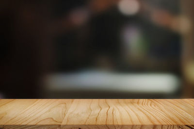 Close-up of wooden table at home