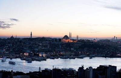 High angle view of city lit up at dusk
