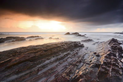 Scenic view of sea against sky during sunset