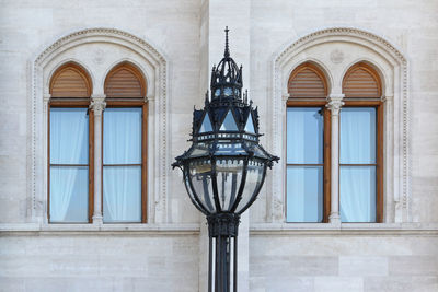 Low angle view of street light on building