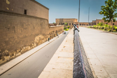 Railing against historic building in city