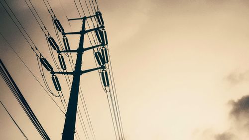 Low angle view of cables against sky