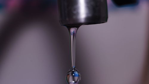 Close-up of faucet in glass