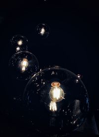 Low angle view of illuminated light bulb