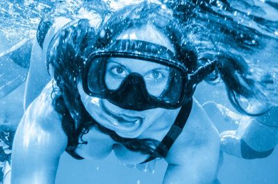 Woman snorkeling underwate