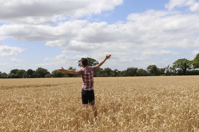 Full length of man standing on field