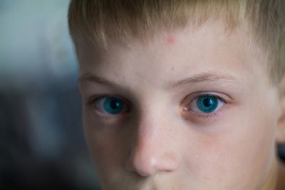 Close-up of a cute boy with blue eyes