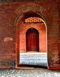 Brick wall with closed door
