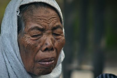 Close-up portrait of a man with eyes closed