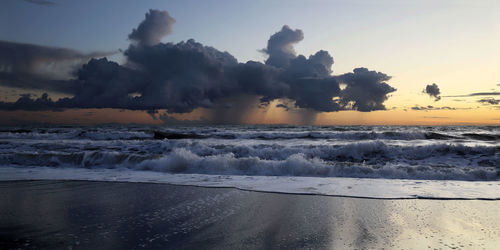 Italy, region tuscany. landscape of  sunset with storm clouds over the sea. panoramic seascape.