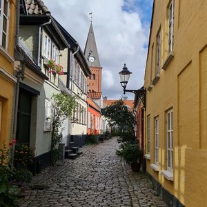 Narrow alley amidst buildings in city