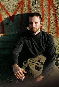Portrait of mid adult man standing outdoors