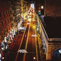 High angle view of illuminated city street at night