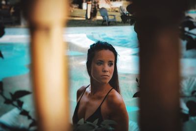 Portrait of woman looking at swimming pool