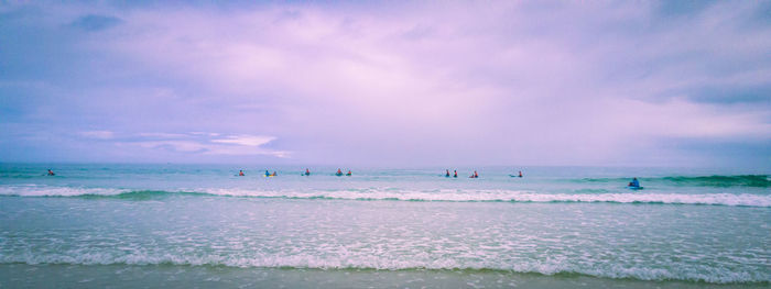 People surfing in sea 