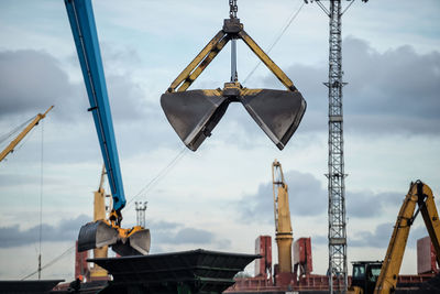 Low angle view of construction site against sky