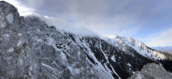 Scenic view of snowcapped mountains against sky