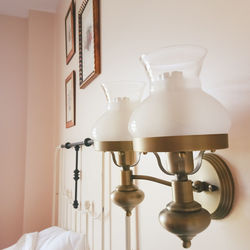 Close-up of electric lamp on wall