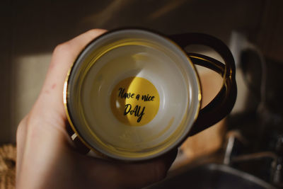 Close-up of hand holding tea cup