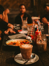 People sitting on table at restaurant