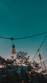 Low angle view of illuminated light against sky