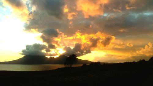 Scenic view of silhouette landscape against sky during sunset