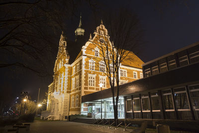 Low angle view of illuminated city at night