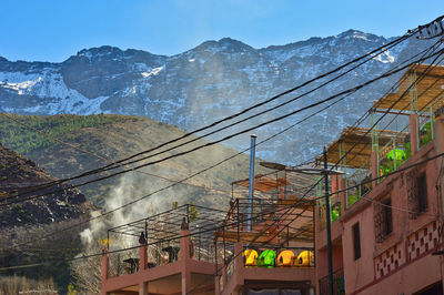 Low angle view of buildings against sky during winter
