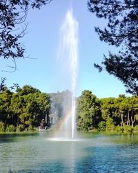 Scenic view of waterfall against sky