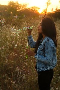 Full length of young woman in park