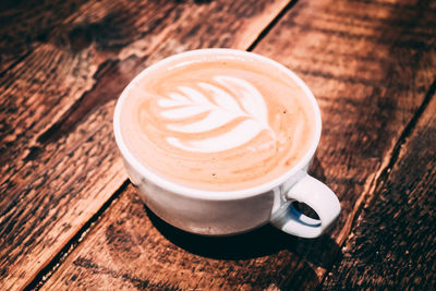 High angle view of cappuccino on table