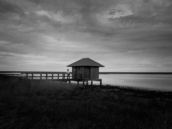 Lifeguard hut on beach against sky