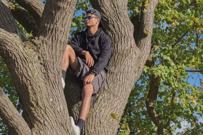 Full length of young man against tree