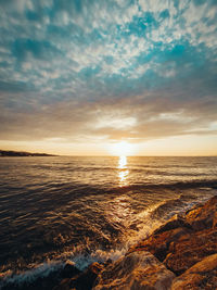 Scenic view of sea against sky during sunset