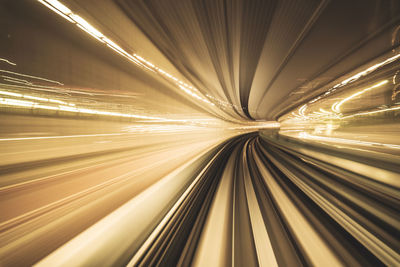 Motion blurred of train moving inside tunnel with daylight in tokyo, japan. 