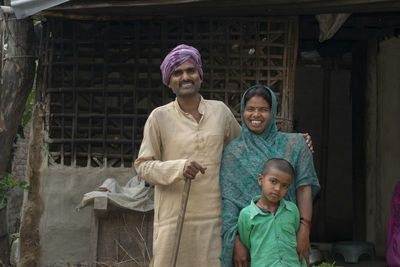 Portrait of a smiling young family of farmer