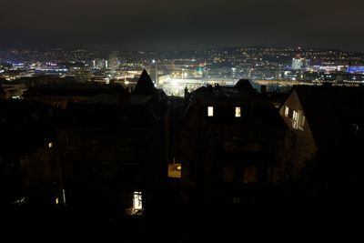 High angle view of buildings in city at night