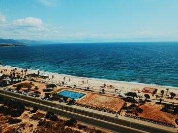 High angle view of road by sea against sky