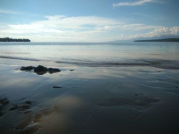 Scenic view of beach against sky