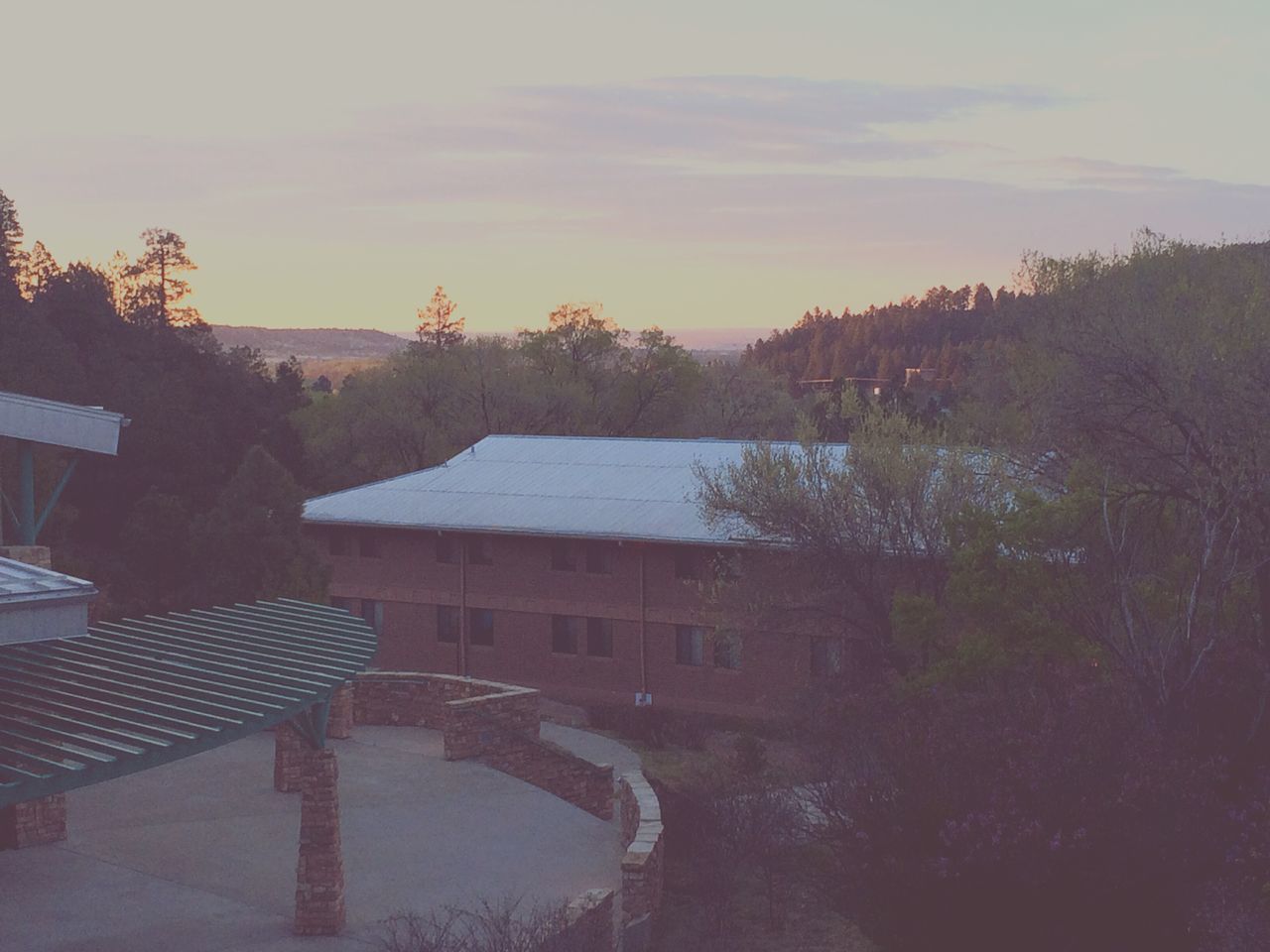 architecture, building exterior, built structure, tree, house, sky, residential structure, residential building, sunset, cloud - sky, outdoors, nature, no people, high angle view, roof, bare tree, building, town, city, weather